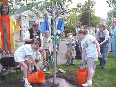 Volunteers planting a tree